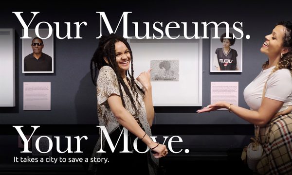 Two smiling people in a gallery with the text that reads 'Your Museums. Your Move.'