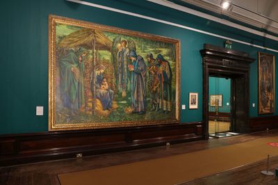 The Star of Bethlehem painting is on the gallery wall. It is a very large painting, bigger than the doorway to the right of it.