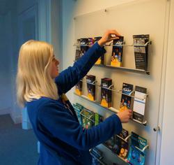 A person rearranging leaflets