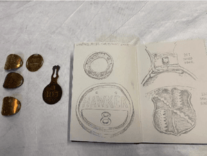 A selection on badges alongside a drawing of them.