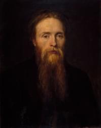 Portrait of a bearded man with red hair, He has a long beard.