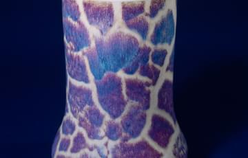 Ceramic vase with a mottled blue pattern