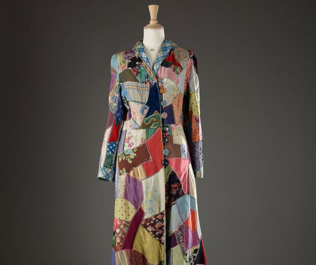 Robe-type garment, wrap over and button fastening at the front, made of pieces of scrap fabric