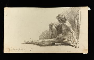 Etching of almost-naked man sitting on the floor, looking away from the artist