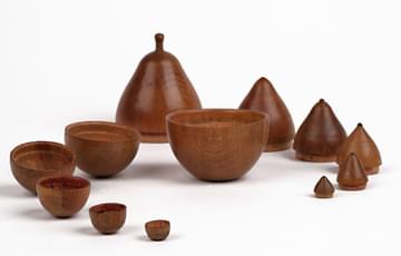 Wood turned to a pear-shape with smaller versions that fit inside
