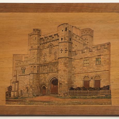 Very detailed wooden mosaic panel creating a picture of the front of a castle