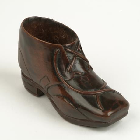 Small wooden match-holder designed to look like a boot