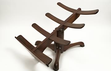 Wooden tripod stand designed to support a sore leg