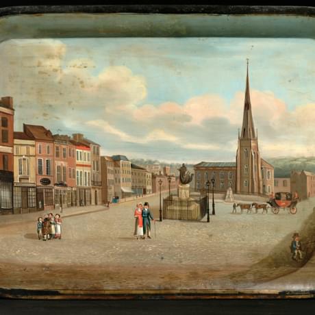 Metal tray painted with a 19th century street scene with a church in the background