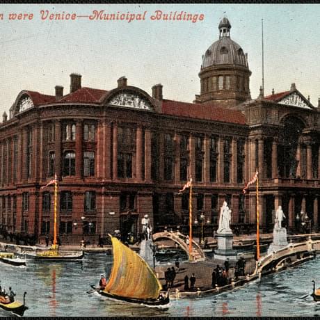 Postcard showing a photographic montage of an image of a canal with boats superimposed over a photo of a civic buliding with columns and a clock tower