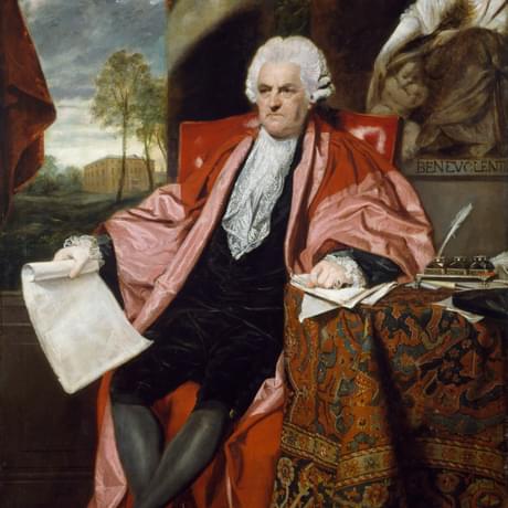 Full length portrait painting of a seated man in 18th century clothing, wearing a white wig and carrying a scroll