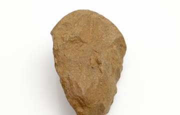 A flat rock in the shape of an axe head