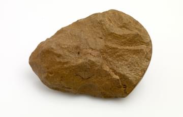 A flat rock in the shape of an axe head