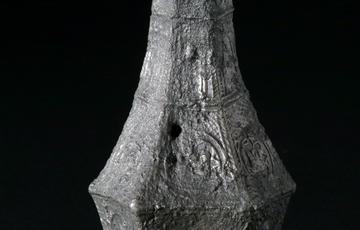 Religious artefact, a patterned bottle made of tin