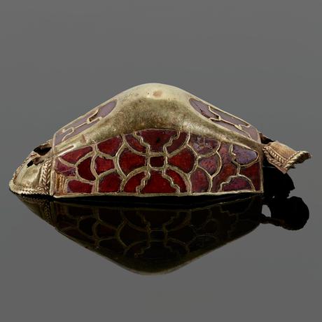 Gold artefact from sword handle, ornately decorated with garnet stones