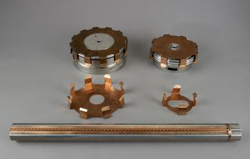 Metal tube and four pronged, metal components