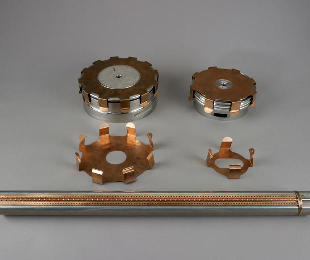 Metal tube and four pronged, metal components