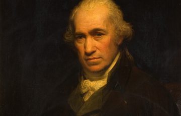 A solemn, elderly man with white hair, dressed in 18th-century formal attire, against a dark background.