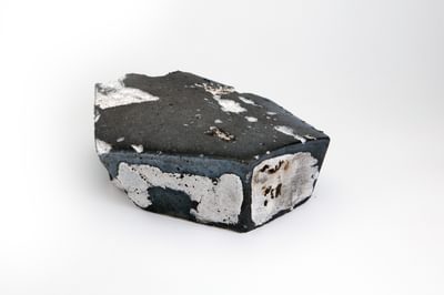 A section of a distressed tile with colour grey, white and blue.