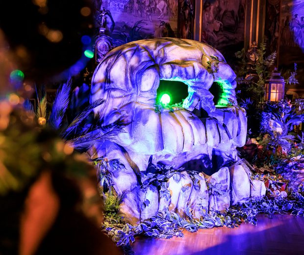 Neverland - a indoor Peter Pan experience. Showing a replica skull with glowing green eyes.