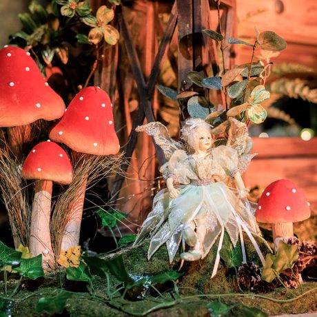 Neverland - a indoor Peter Pan experience. Showing a close up detail of a fairy in a garden.