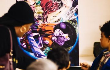 An adult and children looking at a poster in display.