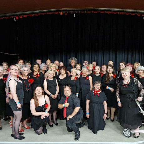 A group of people in a choir.