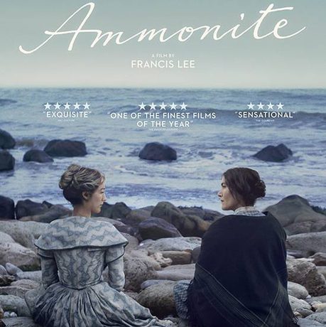 Ammonite film poster featuring film title and two people sitting on rocks in front of the sea.