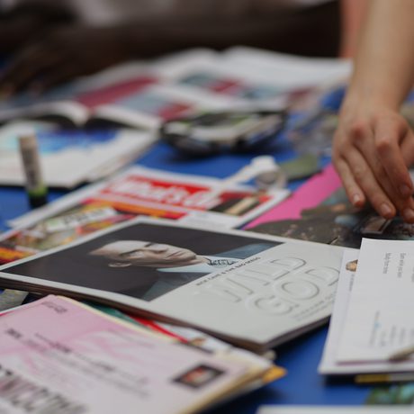 A collection of magazines and postcards on a table