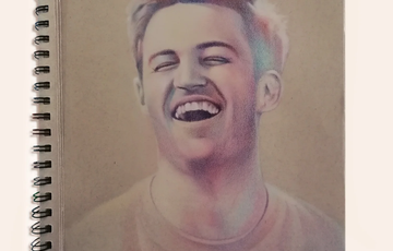 Portrait of a smiling man with hints of colour on a brown background in spiral notepad