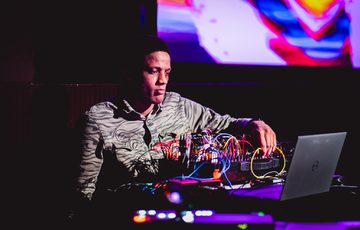 Antonio Roberts with computer and leads on table in front.