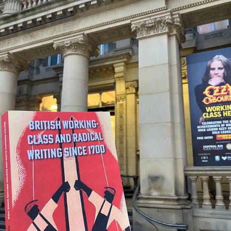 Holding the book British Working-Class and Radical Writing Since 1700 outside of the museum entrance.