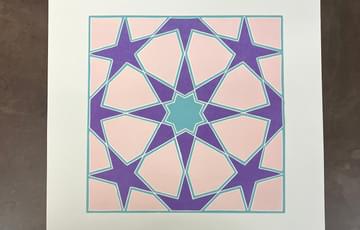 A lino print of a star design.