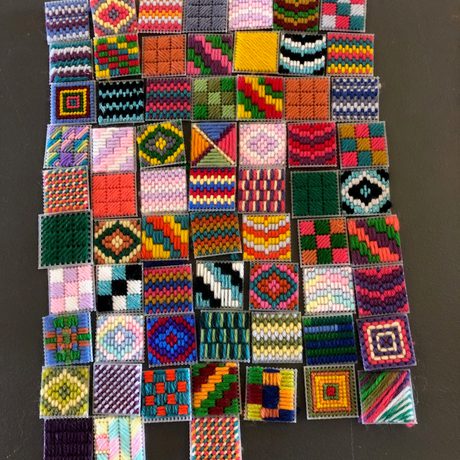 A artwork made of colourful patchwork squares.