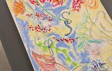 A colourful artwork of flowers.