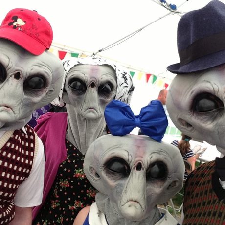 Image with a group of human sized Roswell Alien costumes