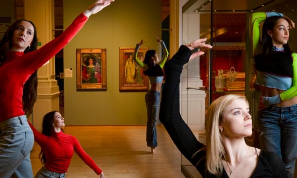 Five ballet dancers posing in the Victorian Radicals exhibition space.