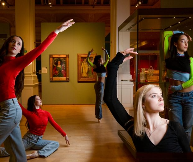 Five ballet dancers posing in the Victorian Radicals exhibition space.