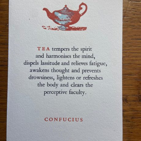 A piece of paper with a teapot and writing on it.