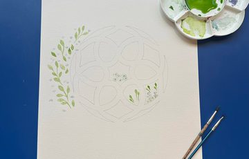 An step by step example artwork in progress on a table.