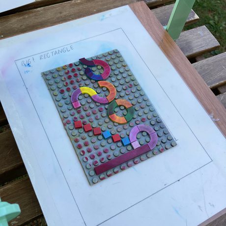 Survey LEGO pieces on a LEGO board to make a print.