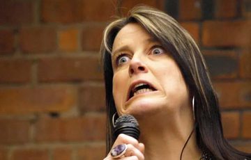 Karen Bayley performing with a microphone.