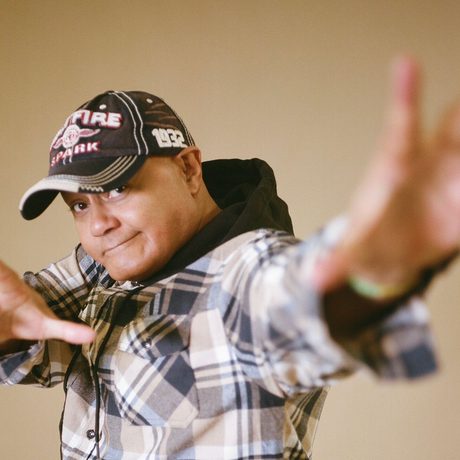 Nik Coppin with hands out in front.