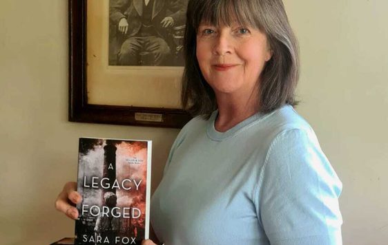An author holding a her book.