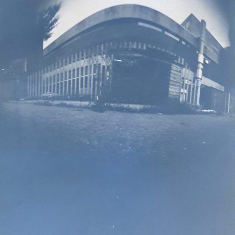 A greyscale photo of a building.