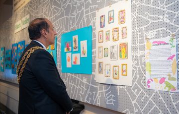 The mayor looking at artworks in the Historic Yardley display.