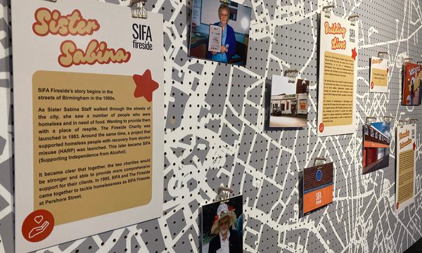 A closeup of photos and information on a display.