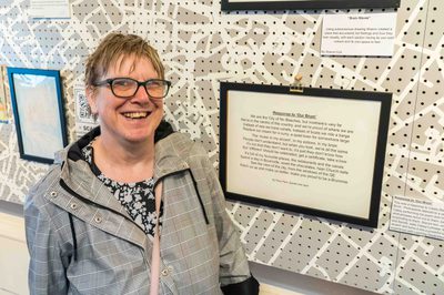 Pam stands proudly in front of her co-created poem “Response to Our Brum”, written with Zainab and Jack, at the Birmingham Museum and Art Gallery exhibition.