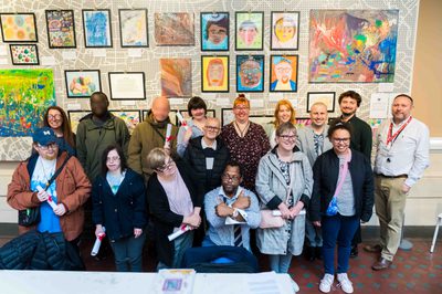 Citizens from Midland Mencap are pictured proudly in front of their artwork at the Birmingham Museum and Art Gallery.