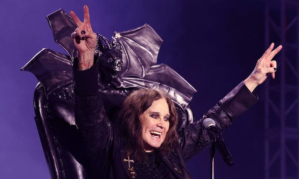 Ozzy Osbourne seated on the throne.